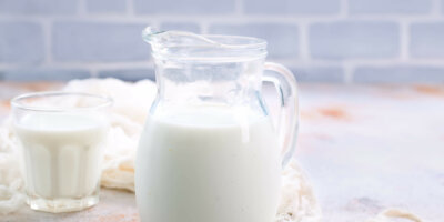 Milk fresh milk in glass and jug on a table